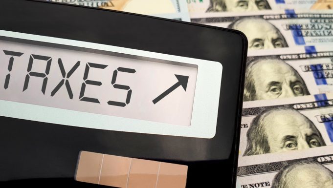 calculator-taxes-up-100-dollar-bills