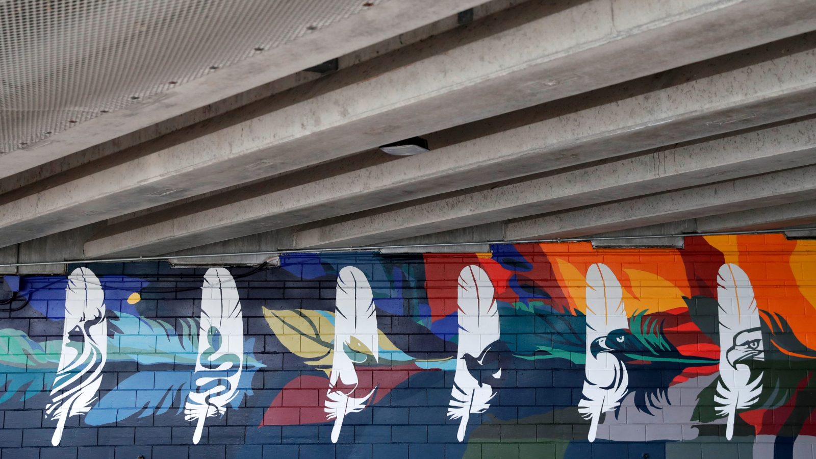 A 130-foot mural located beneath Ray Nischke Memorial Bridge features 12 feathers representing each of the Ho-Chunk Nation's clans. A dedication ceremony was held on Aug. 29, 2024, in Green Bay, Wis.