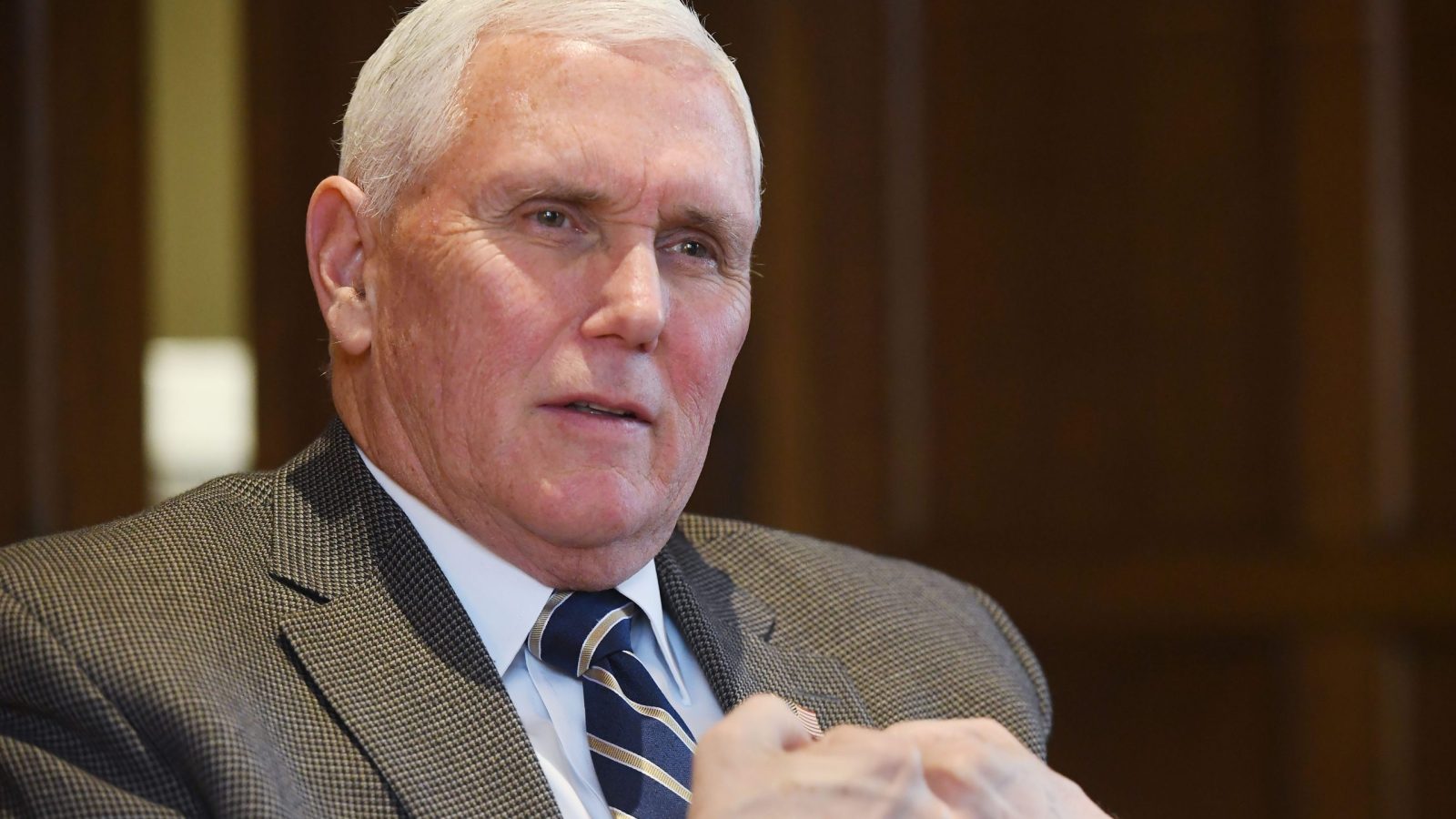 Former U.S. Vice President Mike Pence, speaking in the office of Grove City College President Paul McNulty, demonstrates the national politics of the two major parties prior to teaching a class on campus in Grove City on Feb. 6, 2025.