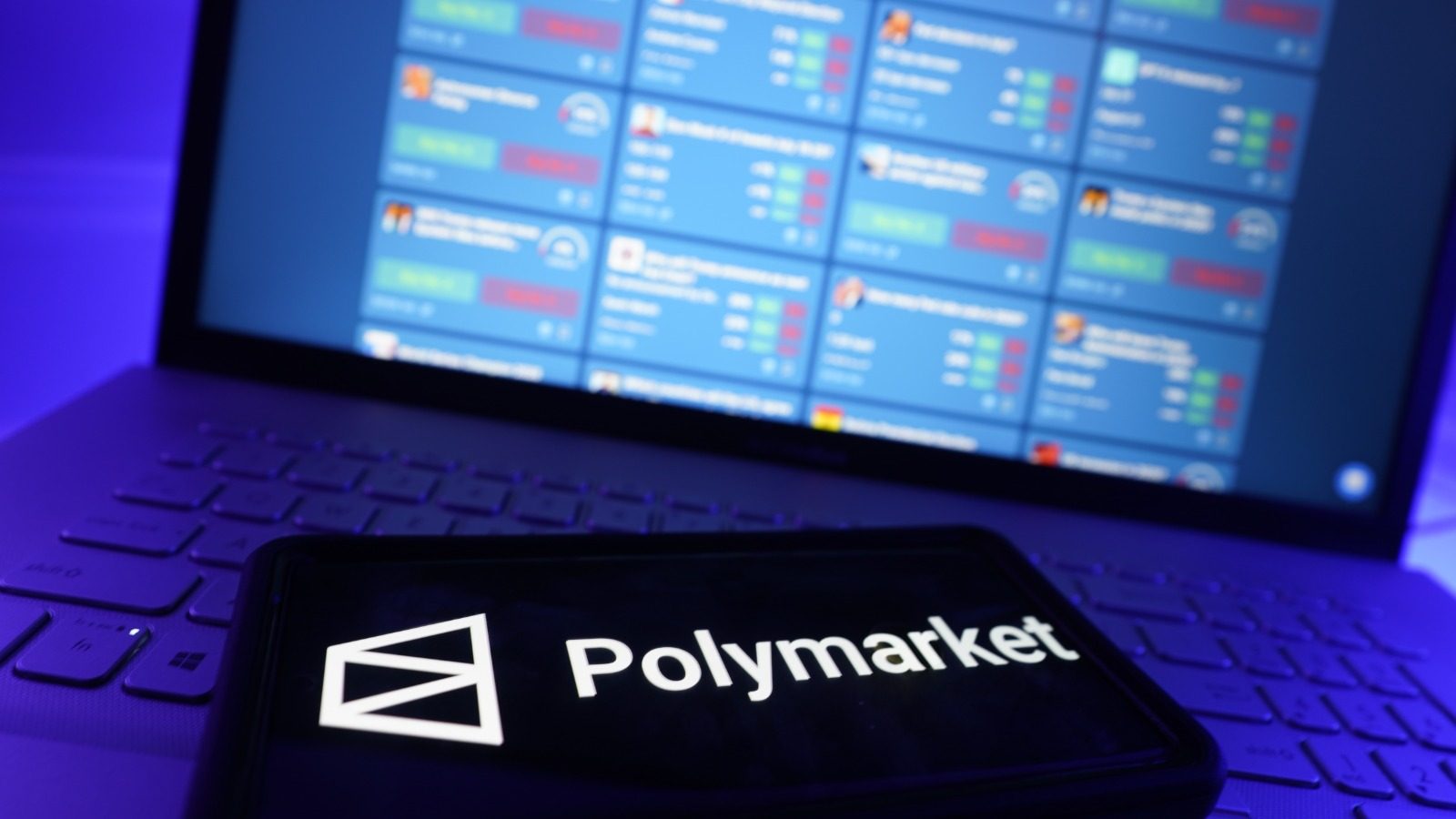 polymarket-logo-phone-computer-background