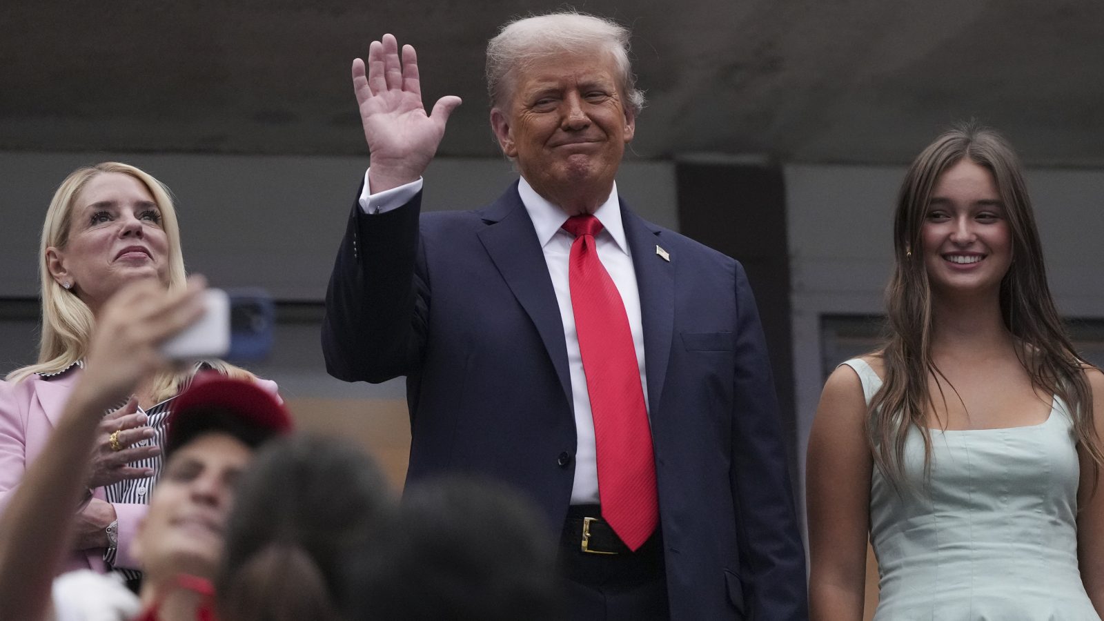 Sep 7, 2025; Flushing, NY, USA; President Donald Trump waves prior to the final of mens singles at Billie Jean King National Tennis Center. Mandatory Credit: Robert Deutsch-Imagn Images