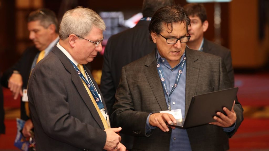 gene-johnson-victor-rocha-talk-at-conference