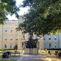 north-carolina-state-house-obscured-trees