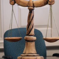 wood-carved-scales-justice
