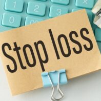 stop-loss-sign-keyboard-hundred-dollar-bills