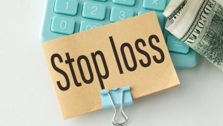 stop-loss-sign-keyboard-hundred-dollar-bills