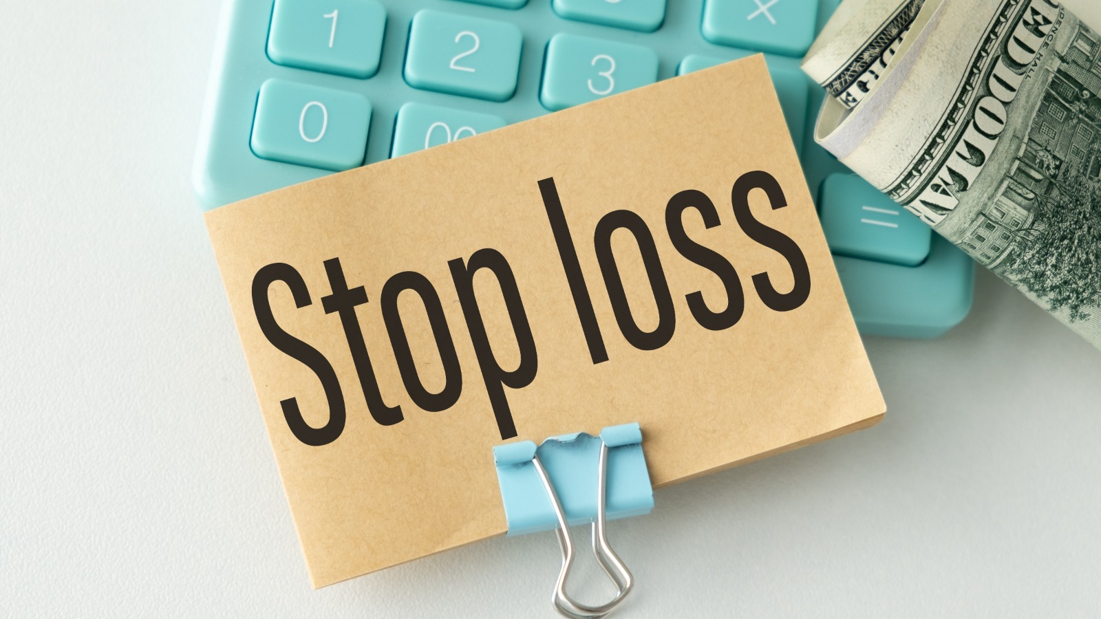 stop-loss-sign-keyboard-hundred-dollar-bills