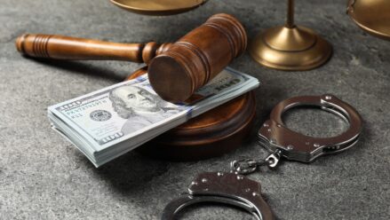 judges-gavel-money-handcuffs