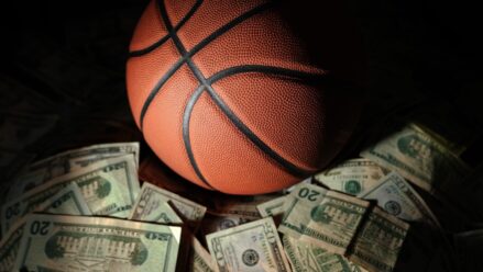 basketball-on-pile-20-dollar-bills